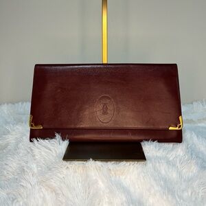Cartier clutch in burgundy